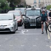 Traffic and cyclists coming out of Regent's Park outer circle