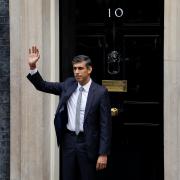 Rishi Sunak waves to the press before entering 10 Downing Street as the new prime minister (Picture: PA)