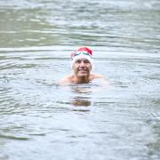 Dr Jon Goldin taking a Christmas dip in Hampstead's Men's Pond
