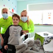 Spurs players Molly Bartrip and Eveliina Summanen pay a visit to young Archie at the Whittington Hospital