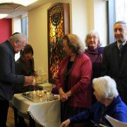 Holocaust survivors light candles in remembrance at the Holocaust Survivors' Centre in Golders Green