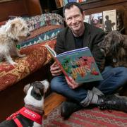 Lonely Planet UK head, Tom Hall, held the 'canine reading' to celebrate World Book Day