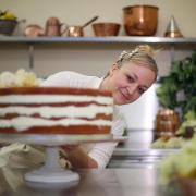 Claire Ptak owner of Violet Bakery in Hackney makes a tier of Harry and Megan's wedding cake in 2018. Her fifth book Love is a Pink Cake includes a recipe for the Royal cake