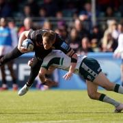 Saracens' Nick Tompkins is tackled by Rory Jennings of London Irish