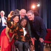TV presenter Ade Adepitan takes a selfie with performer Jessica Lucia Andrade, Marcus Davey, and Sir Keir Starmer at the opening of Roundhouse Works a new creative centre to nurture young talent.