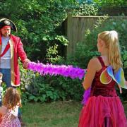 Pirate Nick and Mystical Fairy Michelina held a limbo dance at the Family Garden Party at Keats House Museum