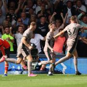 Tottenham celebrate Micky van de Ven's goal at Luton