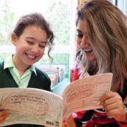 Sarum Hall pupil Suki Dell with Rebecca Paul, the teacher who encouraged to write her own stories