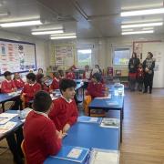 Shaun Wallace, aka 'The Dark Destroyer' on ITV's The Chase, speaks to pupils at Braintcroft E-Act Primary Academy