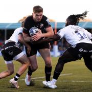 Saracens' Owen Farrell forces his way through the Bristol defence