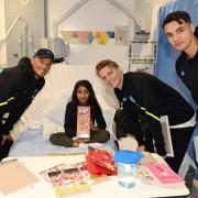 Players handed out Christmas gifts on a children's ward at the Royal Free