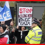 People take part in a protest opposite the Israeli ambassadors residence, as part of the Stop the War Coalition's Day of Action for Palestine, in London