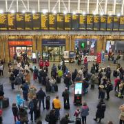 King's Cross station will be shut on Christmas Eve. Pictured: Passengers at King's Cross yesterday (December 22)