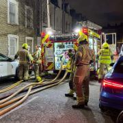 A flat above a shop was destroyed and two people were taken to hospital in a fire above shops in Holloway Road, Kentish Town