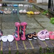 Youth Demand laid rows of children’s shoes in front of the Labour leader’s door