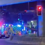 Emergency service vehicles with blue flashing lights were at the scene at Staples Corner late last night (April 14)