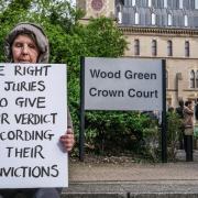 A Highgate XR campaigner calling for jury rights outside Wood Green Crown Court