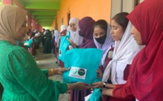 Camdener Nazma Begum handing out dignity packages to women in the Sylhet region of Bangladesh