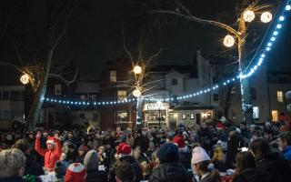 Crowds enjoy the Highgate Christmas Carol Service in Pond Square