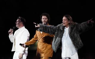 (left to right) Gary Barlow, Howard Donald and Mark Owen from Take That performing on stage at BST Hyde Park