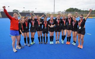 Haringey celebrate success in the girls hockey competition.