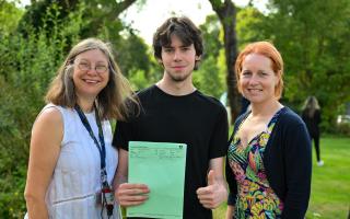 Nathan Crawford with William Ellis School's Flora Wilson head of 6th Form (L) and Izzy Jones, head
