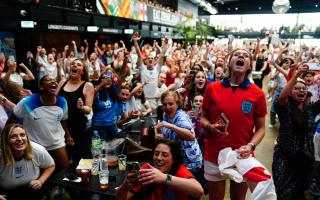 England fans celebrate following a screening of the FIFA Women's World Cup 2023 semi-final at BOXPARK Wembley