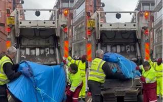 Camden Council's waste collectors were seen putting the tents in a truck